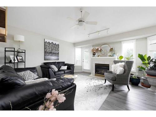 21-264 J W Mann, Fort Mcmurray, AB - Indoor Photo Showing Living Room With Fireplace