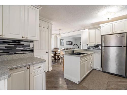399 Cornwall Drive, Fort Mcmurray, AB - Indoor Photo Showing Kitchen With Double Sink