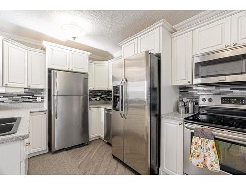 399 Cornwall Drive, Fort Mcmurray, AB - Indoor Photo Showing Kitchen With Double Sink