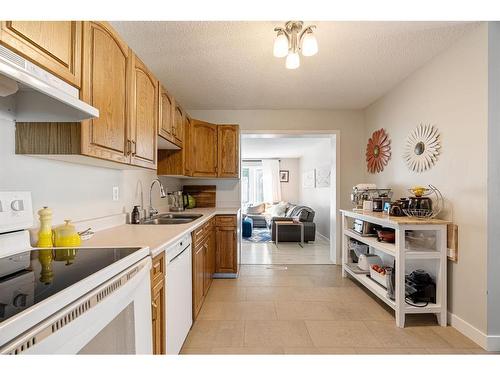 14 Moberly Crescent, Fort Mcmurray, AB - Indoor Photo Showing Kitchen With Double Sink