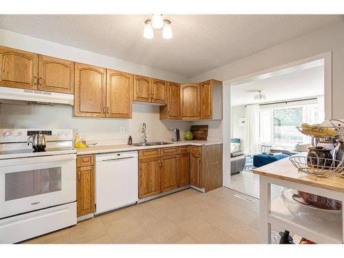 14 Moberly Crescent, Fort Mcmurray, AB - Indoor Photo Showing Kitchen With Double Sink