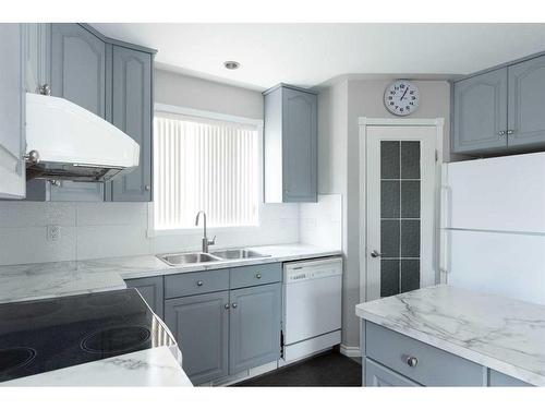 168 Bussieres Drive, Fort Mcmurray, AB - Indoor Photo Showing Kitchen With Double Sink