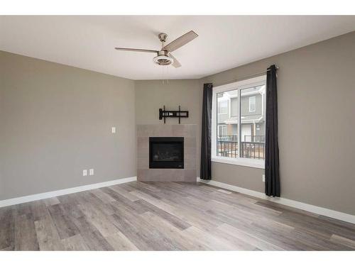 14-401 Athabasca Avenue, Fort Mcmurray, AB - Indoor Photo Showing Living Room With Fireplace