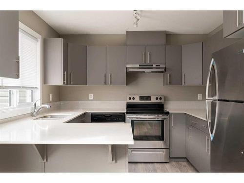 14-401 Athabasca Avenue, Fort Mcmurray, AB - Indoor Photo Showing Kitchen With Double Sink With Upgraded Kitchen