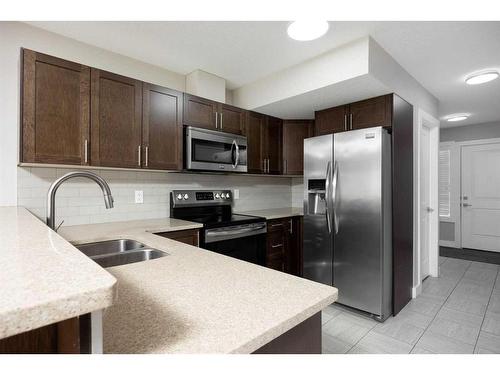 Unit# 36-284 Shalestone Way, Fort Mcmurray, AB - Indoor Photo Showing Kitchen With Stainless Steel Kitchen With Double Sink With Upgraded Kitchen