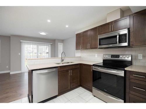 Unit# 36-284 Shalestone Way, Fort Mcmurray, AB - Indoor Photo Showing Kitchen With Stainless Steel Kitchen With Double Sink