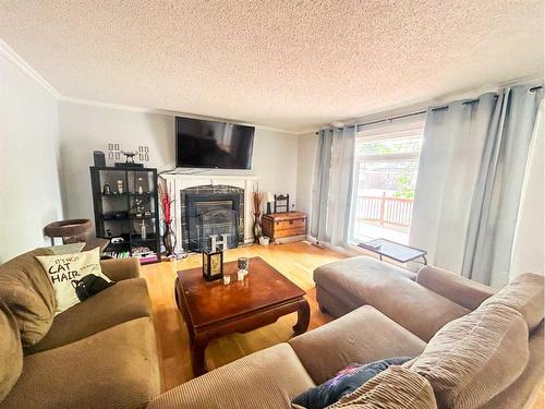 125 Cameron Drive, Fort Mcmurray, AB - Indoor Photo Showing Living Room With Fireplace