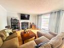 125 Cameron Drive, Fort Mcmurray, AB  - Indoor Photo Showing Living Room With Fireplace 