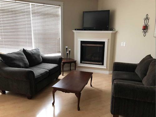 28-411 Williams Drive, Fort Mcmurray, AB - Indoor Photo Showing Living Room With Fireplace