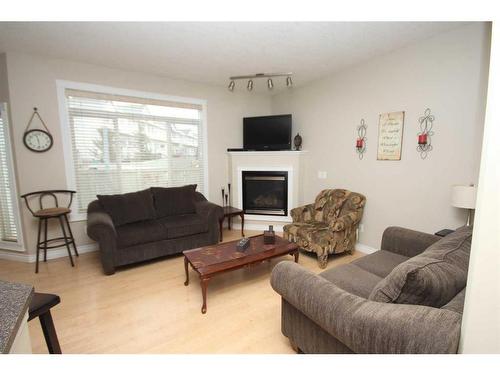 28-411 Williams Drive, Fort Mcmurray, AB - Indoor Photo Showing Living Room With Fireplace