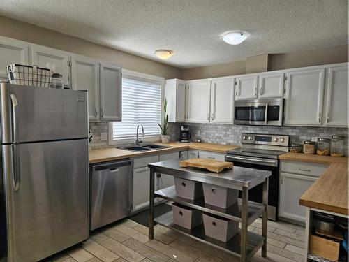 131 Wolverine Drive, Fort Mcmurray, AB - Indoor Photo Showing Kitchen With Stainless Steel Kitchen With Double Sink