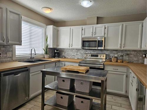 131 Wolverine Drive, Fort Mcmurray, AB - Indoor Photo Showing Kitchen With Stainless Steel Kitchen With Double Sink