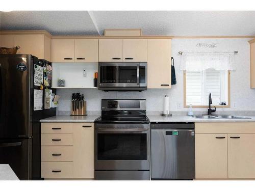 109 Waterhouse Street, Fort Mcmurray, AB - Indoor Photo Showing Kitchen With Double Sink