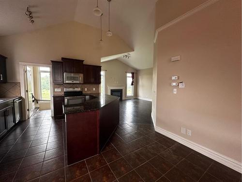 224 Fireweed Crescent, Fort Mcmurray, AB - Indoor Photo Showing Kitchen With Fireplace