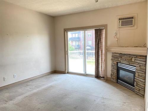 213-9918 Gordon Avenue, Fort Mcmurray, AB - Indoor With Fireplace