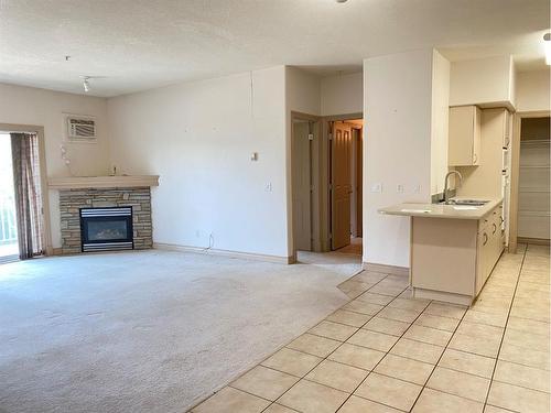 213-9918 Gordon Avenue, Fort Mcmurray, AB - Indoor Photo Showing Living Room With Fireplace