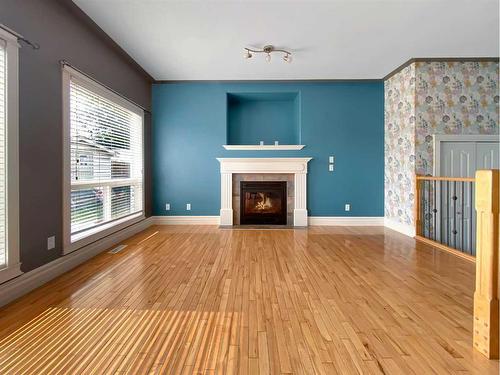 146 Plamondon Way, Fort Mcmurray, AB - Indoor Photo Showing Living Room With Fireplace