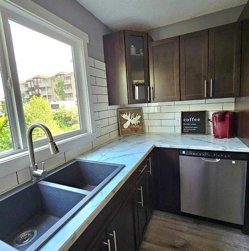 10303 101 St, Lac La Biche, AB - Indoor Photo Showing Kitchen With Double Sink