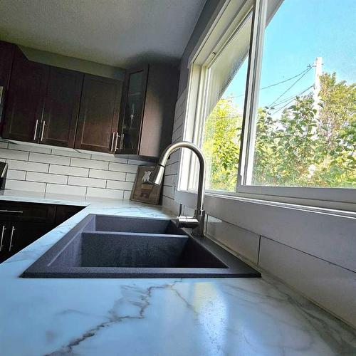 10303 101 St, Lac La Biche, AB - Indoor Photo Showing Kitchen With Double Sink