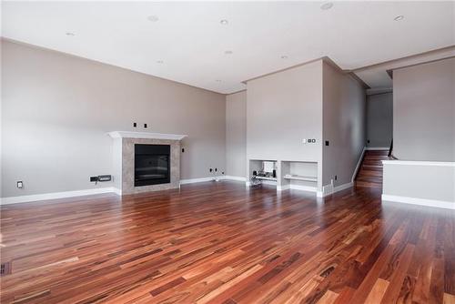 105 Cormorant Place, Fort Mcmurray, AB - Indoor Photo Showing Living Room With Fireplace