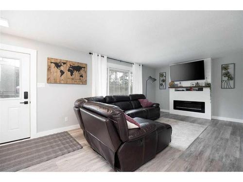 149 Ermine Crescent, Fort Mcmurray, AB - Indoor Photo Showing Living Room With Fireplace