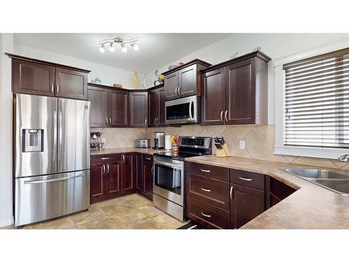 152 Fireweed Crescent, Fort Mcmurray, AB - Indoor Photo Showing Kitchen With Double Sink
