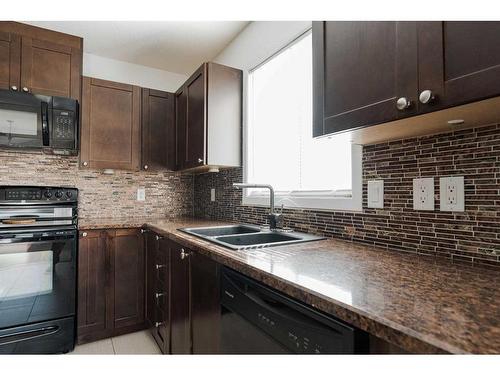 307-104 Loutit Road, Fort Mcmurray, AB - Indoor Photo Showing Kitchen With Double Sink