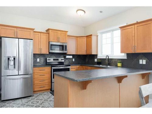 211 Woodpecker Way, Fort Mcmurray, AB - Indoor Photo Showing Kitchen With Stainless Steel Kitchen With Double Sink