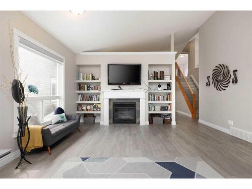 211 Woodpecker Way, Fort Mcmurray, AB - Indoor Photo Showing Living Room With Fireplace