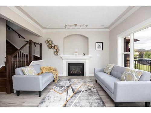 231 Merganser Crescent, Fort Mcmurray, AB - Indoor Photo Showing Living Room With Fireplace