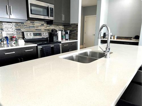 105 Dehoog Crescent, Fort Mcmurray, AB - Indoor Photo Showing Kitchen With Double Sink With Upgraded Kitchen