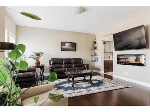 19-300 Sparrow Hawk Drive, Fort Mcmurray, AB - Indoor Photo Showing Living Room With Fireplace