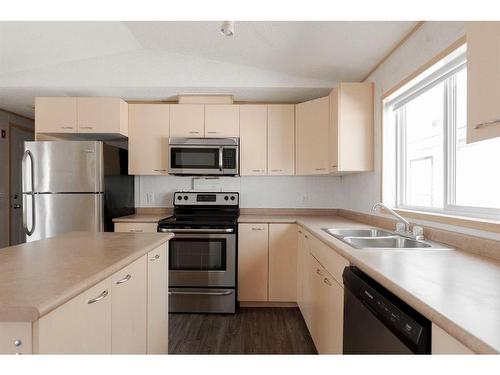 125 Hoehne Street, Fort Mcmurray, AB - Indoor Photo Showing Kitchen With Stainless Steel Kitchen With Double Sink