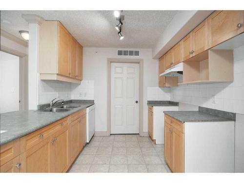 2406-38 Riedel Street, Fort Mcmurray, AB - Indoor Photo Showing Kitchen With Double Sink