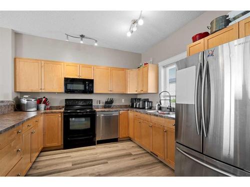 56-313 Millennium Drive, Fort Mcmurray, AB - Indoor Photo Showing Kitchen With Stainless Steel Kitchen With Double Sink