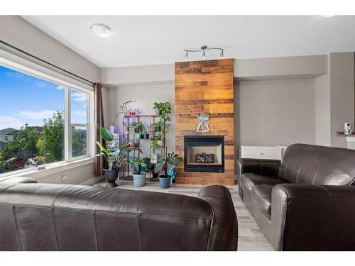 56-313 Millennium Drive, Fort Mcmurray, AB - Indoor Photo Showing Living Room With Fireplace