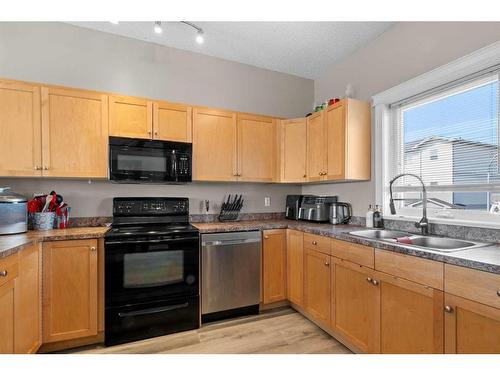 56-313 Millennium Drive, Fort Mcmurray, AB - Indoor Photo Showing Kitchen With Double Sink