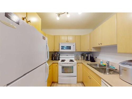 1211-200 Lougheed Drive, Fort Mcmurray, AB - Indoor Photo Showing Kitchen With Double Sink