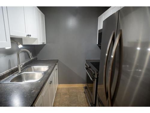 304-11721 Macdonald Drive, Fort Mcmurray, AB - Indoor Photo Showing Kitchen With Double Sink