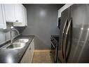 304-11721 Macdonald Drive, Fort Mcmurray, AB  - Indoor Photo Showing Kitchen With Double Sink 