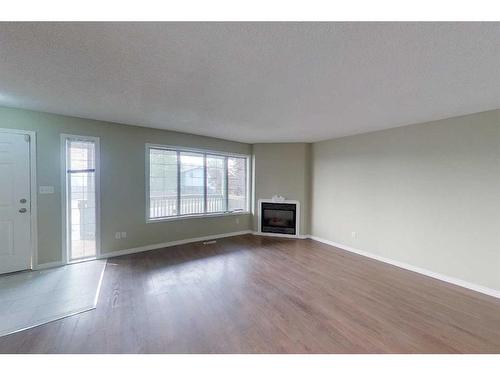 100 Sirius Avenue, Fort Mcmurray, AB - Indoor Photo Showing Living Room With Fireplace