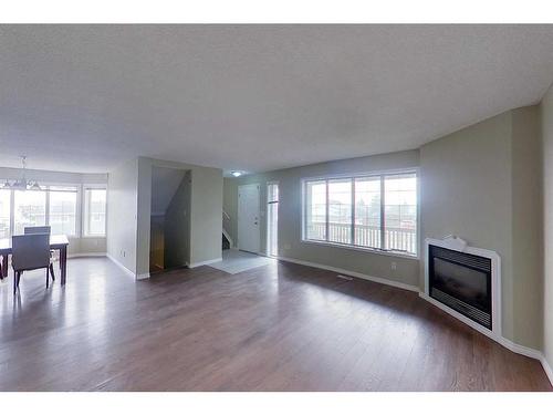 100 Sirius Avenue, Fort Mcmurray, AB - Indoor Photo Showing Living Room With Fireplace