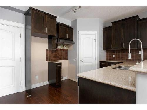 103-9919 Gordon Avenue, Fort Mcmurray, AB - Indoor Photo Showing Kitchen With Double Sink