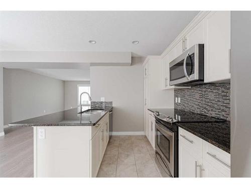 149 Callen Drive, Fort Mcmurray, AB - Indoor Photo Showing Kitchen With Upgraded Kitchen