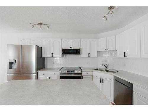 140 Archibald Close, Fort Mcmurray, AB - Indoor Photo Showing Kitchen With Double Sink