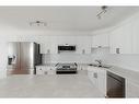 140 Archibald Close, Fort Mcmurray, AB  - Indoor Photo Showing Kitchen With Double Sink 