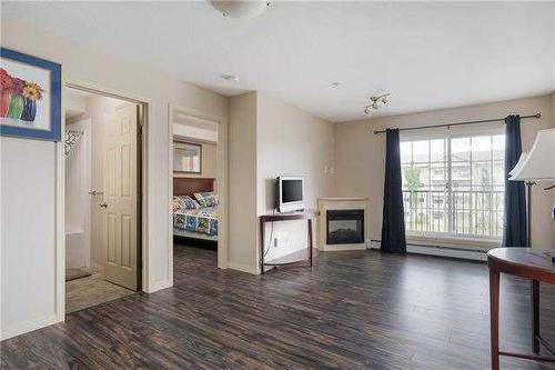 2301-200 Lougheed Drive, Fort Mcmurray, AB - Indoor Photo Showing Living Room With Fireplace