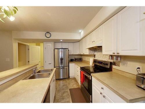 2-248C Grosbeak Way, Fort Mcmurray, AB - Indoor Photo Showing Kitchen With Stainless Steel Kitchen With Double Sink