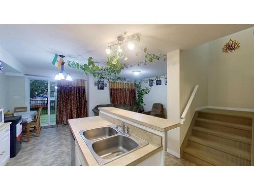 2-248C Grosbeak Way, Fort Mcmurray, AB - Indoor Photo Showing Kitchen With Double Sink