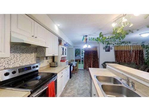 2-248C Grosbeak Way, Fort Mcmurray, AB - Indoor Photo Showing Kitchen With Double Sink